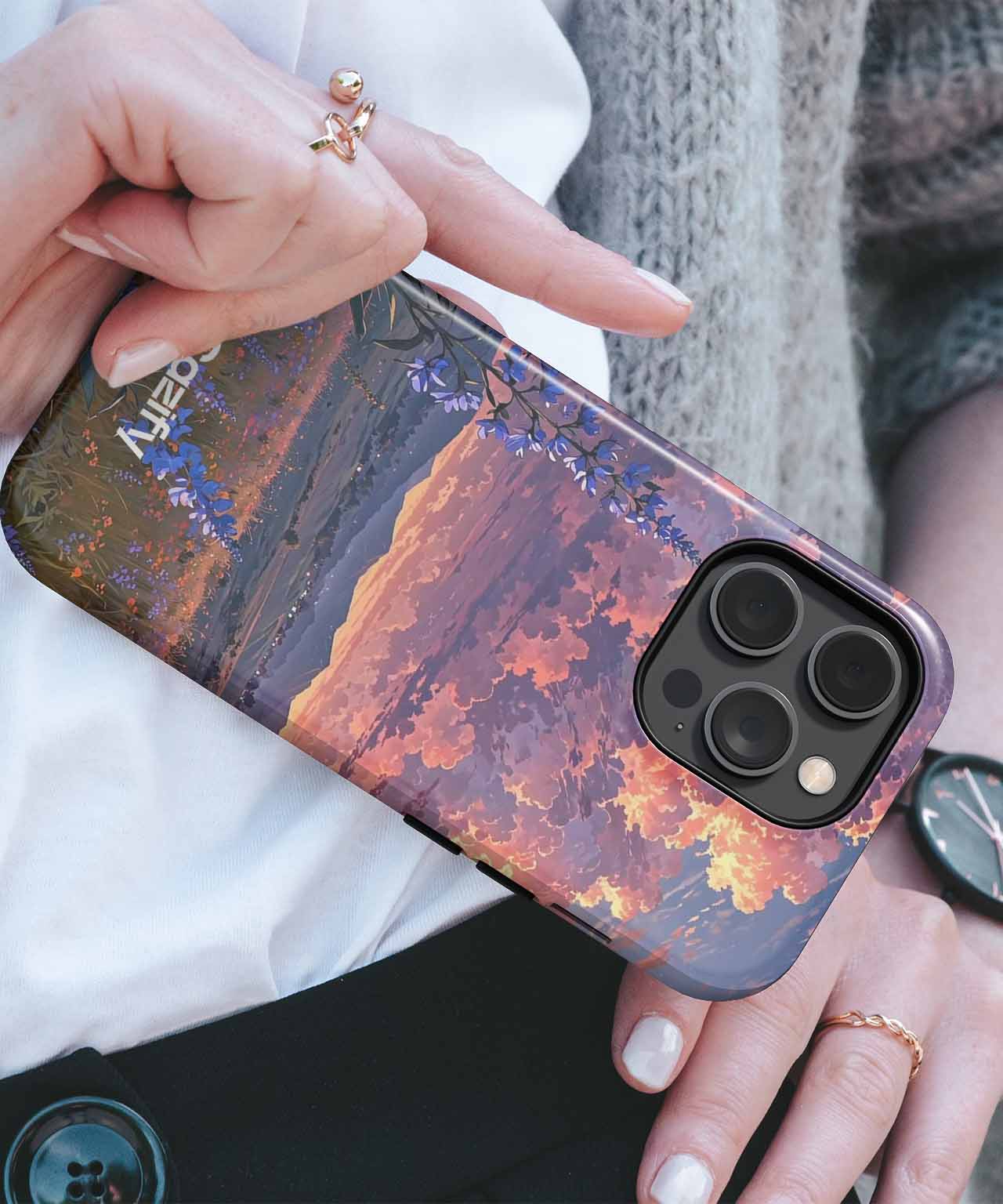Cazify Canada - IPhone with dark orange and purple sunset design case and triple camera cutout.