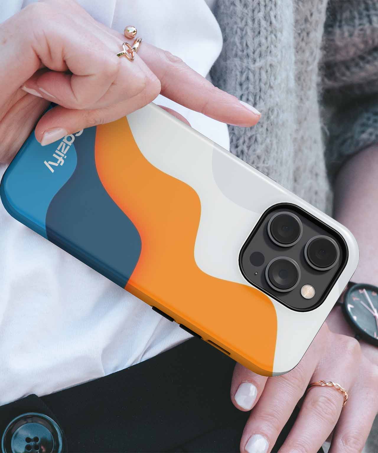 IPhone case with blue, orange, and white abstract wave design holding smartphone with triple camera. - Cazify Canada