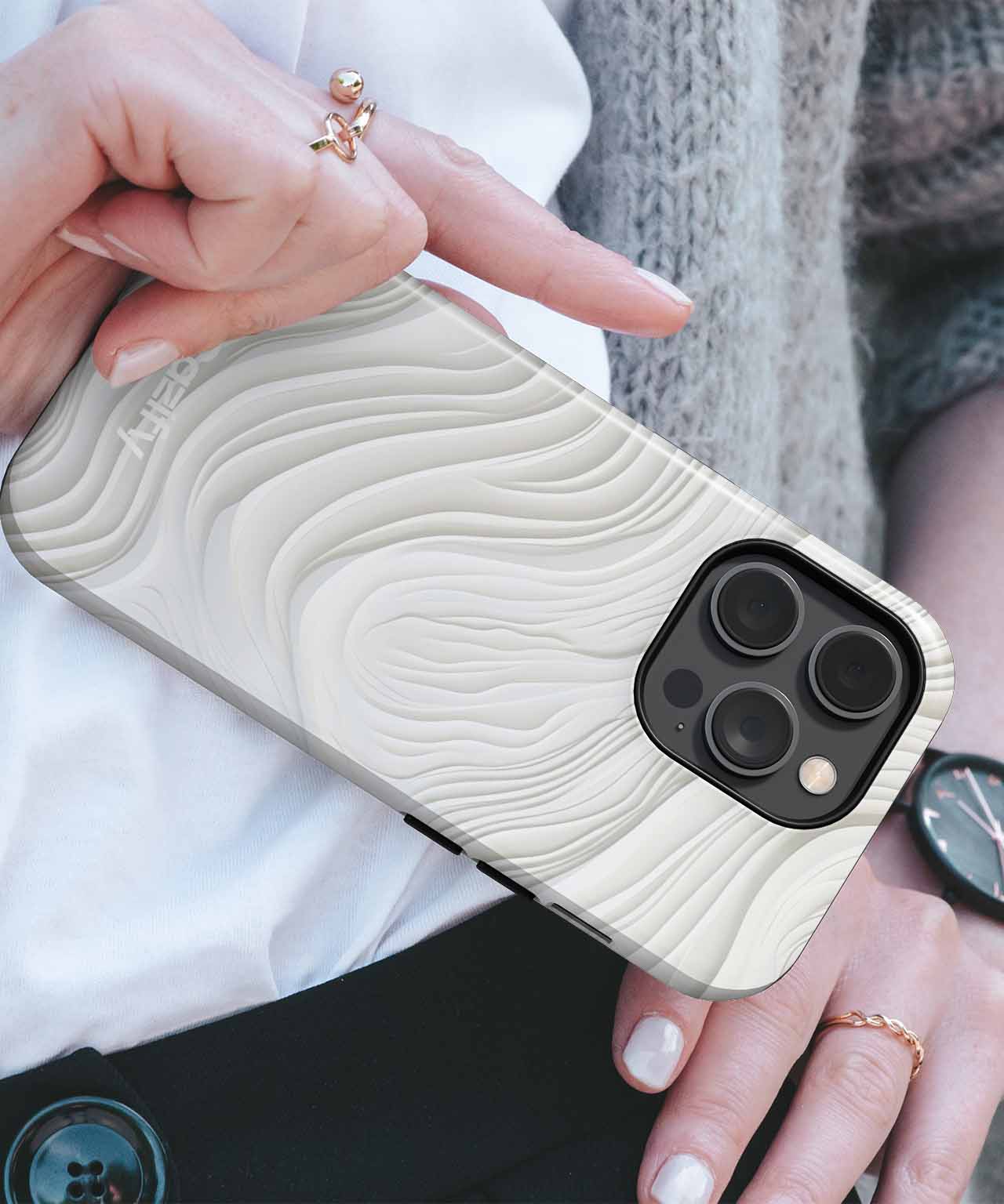 Cream-colored iPhone case with raised wavy textured design and black camera cutout. - Cazify Canada