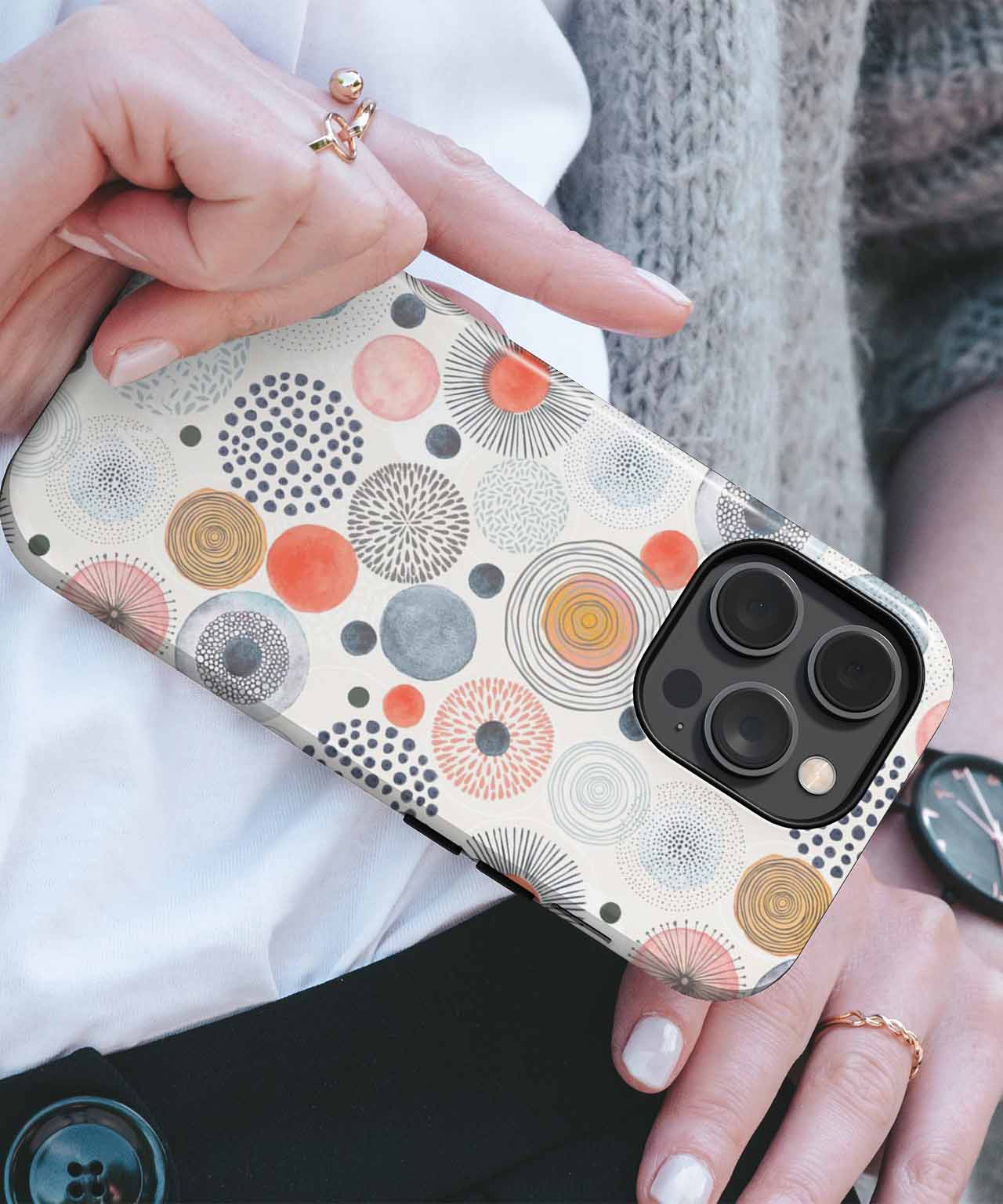 Beige iPhone case with multi-colored circular patterns and large camera cutout. - Cazify Canada