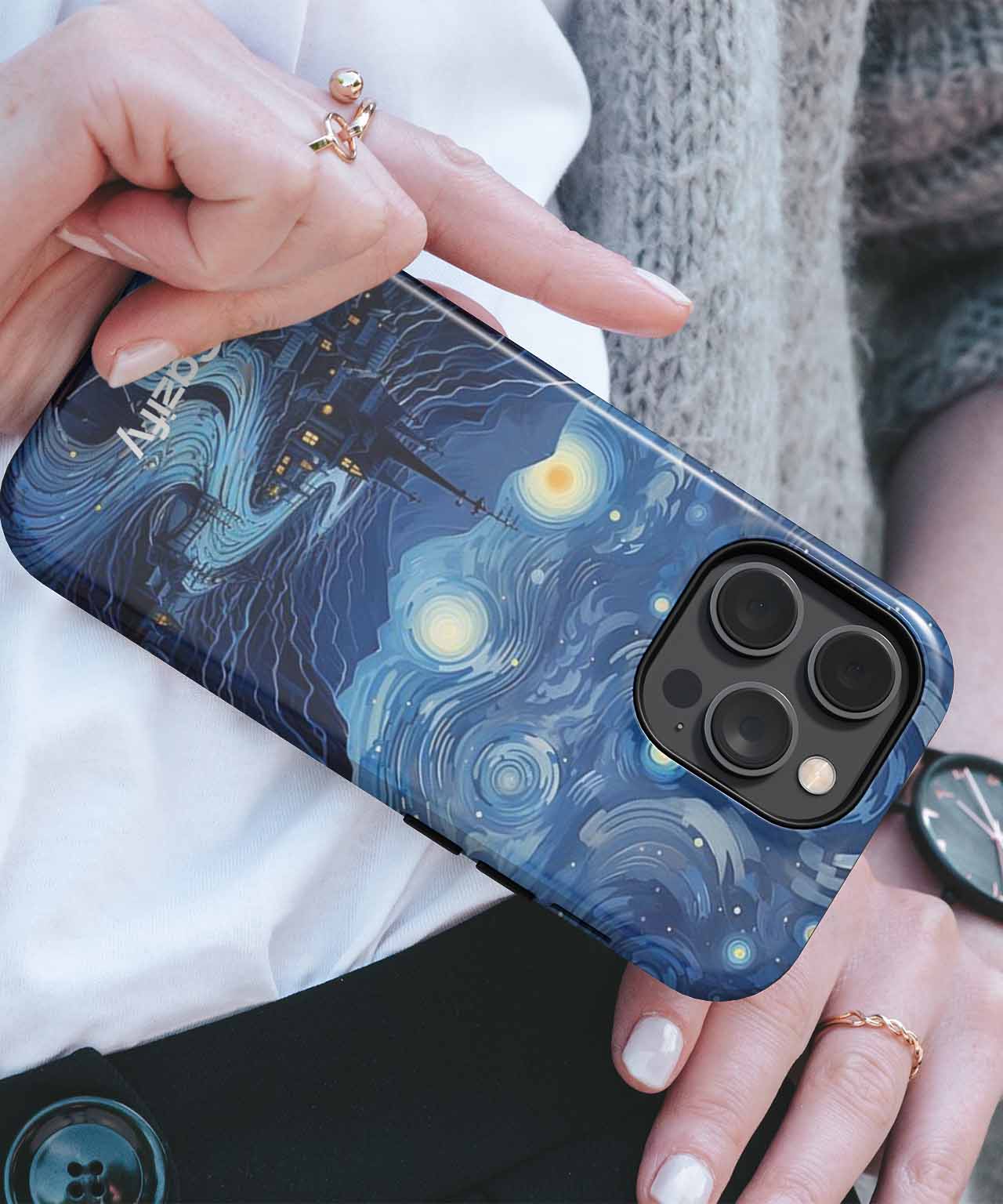 Cazify Canada - Blue phone case with a swirling starry night sky design and gold accents on an iPhone Pro Max model.