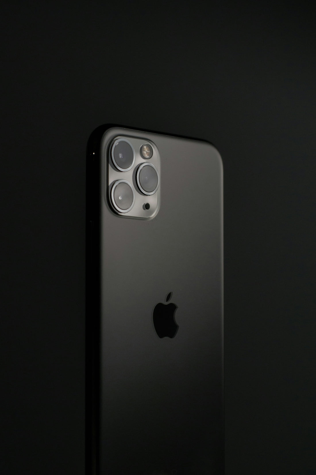 silver iphone 6 on black surface