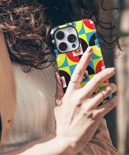 Colorful geometric pattern phone case on silver iPhone with triple camera lenses. - Cazify Canada