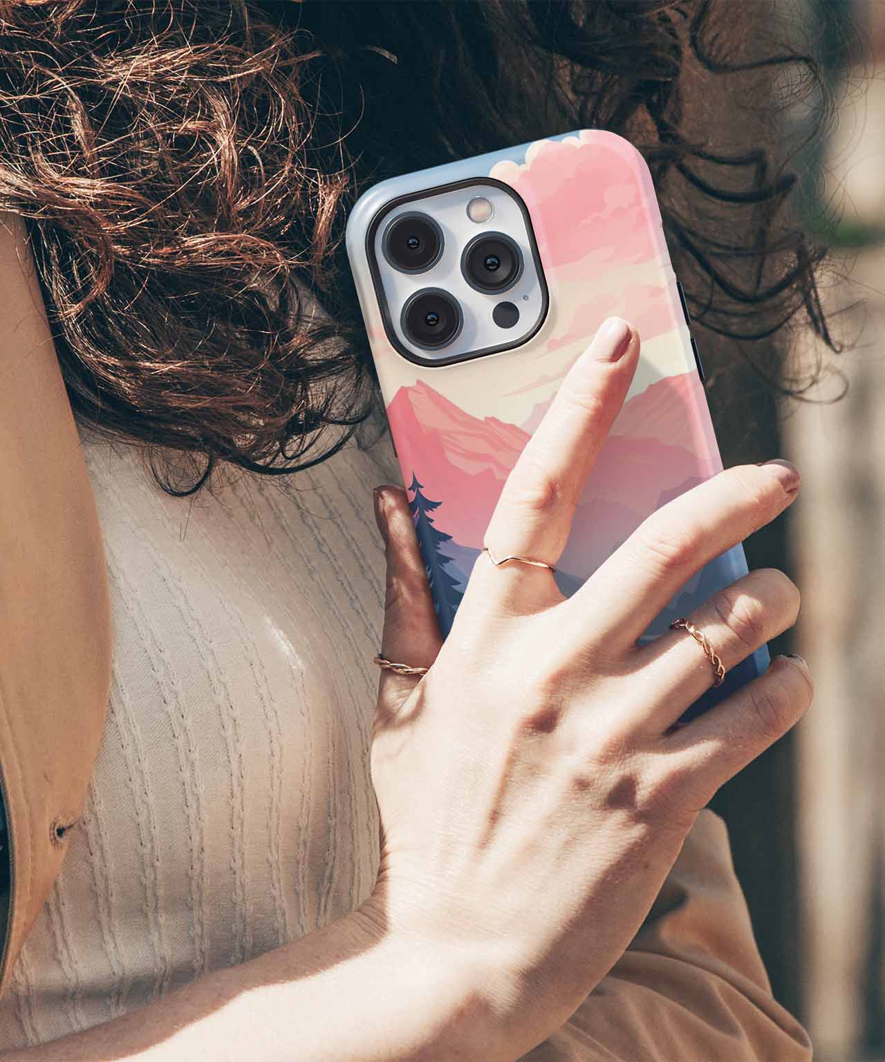 Cazify Canada - Pink and purple abstract pattern iPhone case on a smartphone with triple camera lenses.